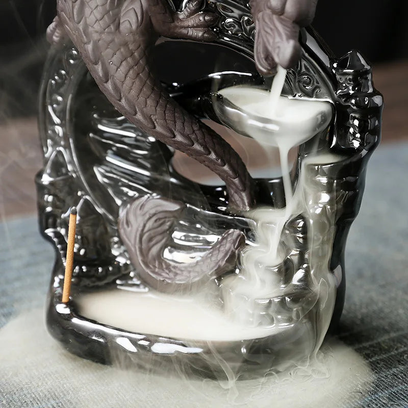 Close-up of detailed ceramic dragon on backflow incense burner