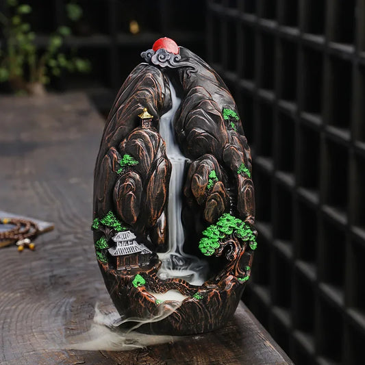 Front view of tall resin backflow incense burner with Zen mountain design