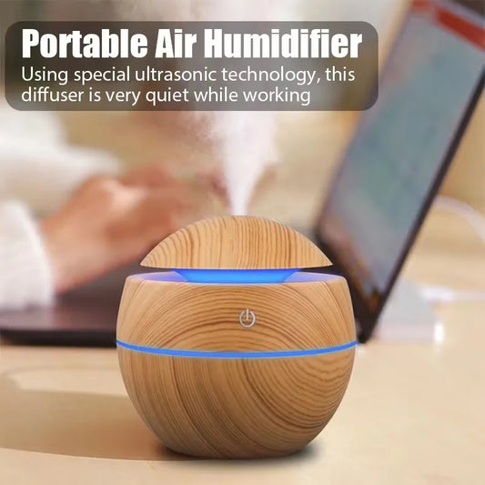 USB ultrasonic aroma diffuser with wood grain design, cool mist humidifier, essential oil compatible.